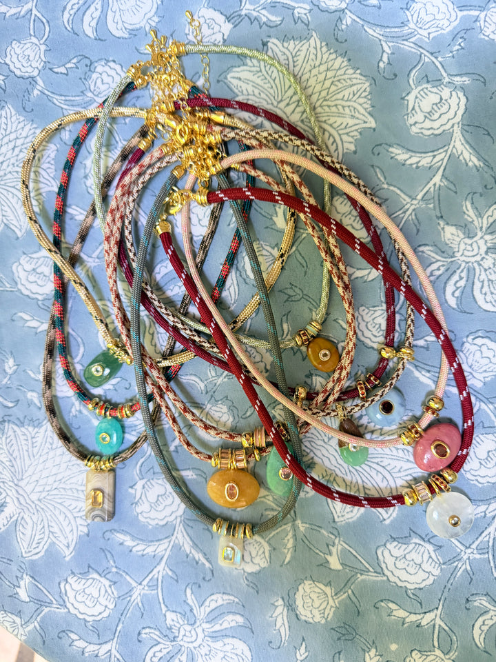 Chrysoprase Drop Charm on Cream and Brown Cord Necklace