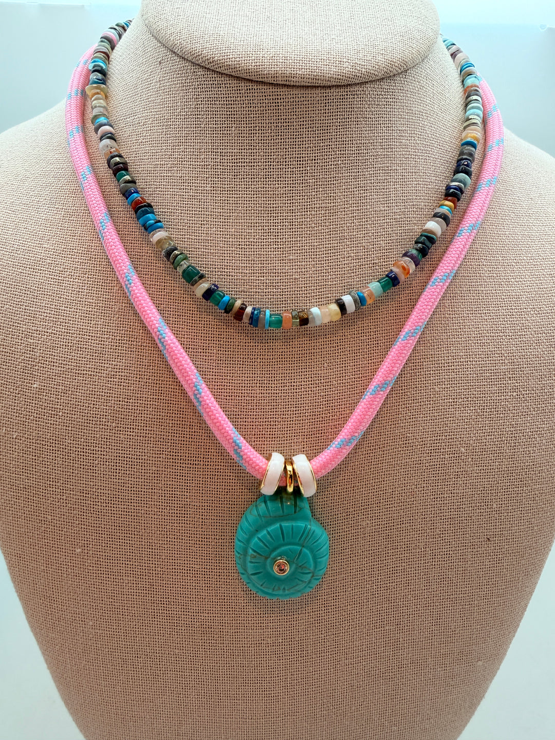 Turquoise Howlite Spiral Shell on Pink Cord Necklace