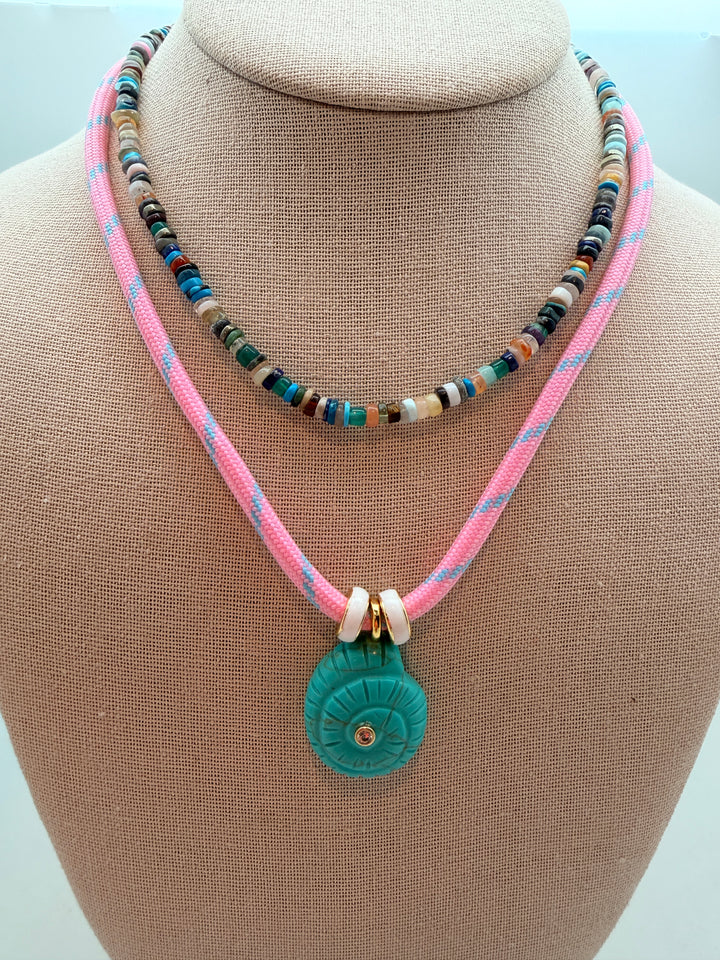 Turquoise Howlite Spiral Shell on Pink Cord Necklace