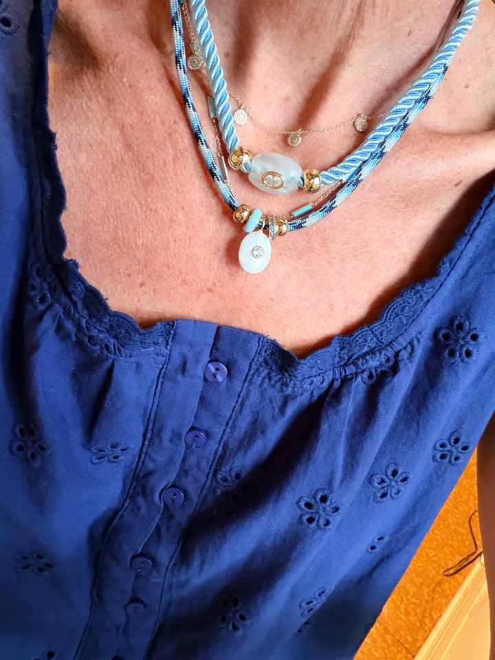 White Quartz Oval on Light Blue Cord Necklace