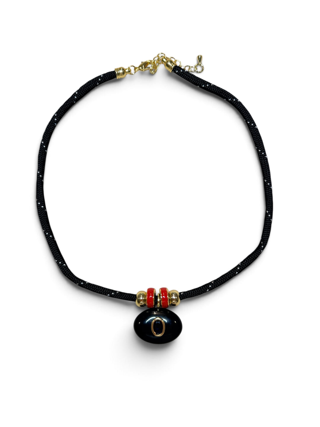 Black Oval Pendant with Red Spacers on a Black Cord Necklace