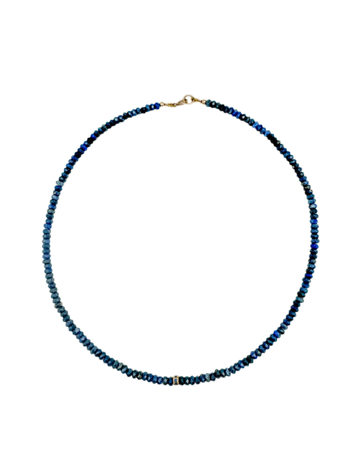 4mm wide lapis beads with a 14k gold and sapphire center bead
